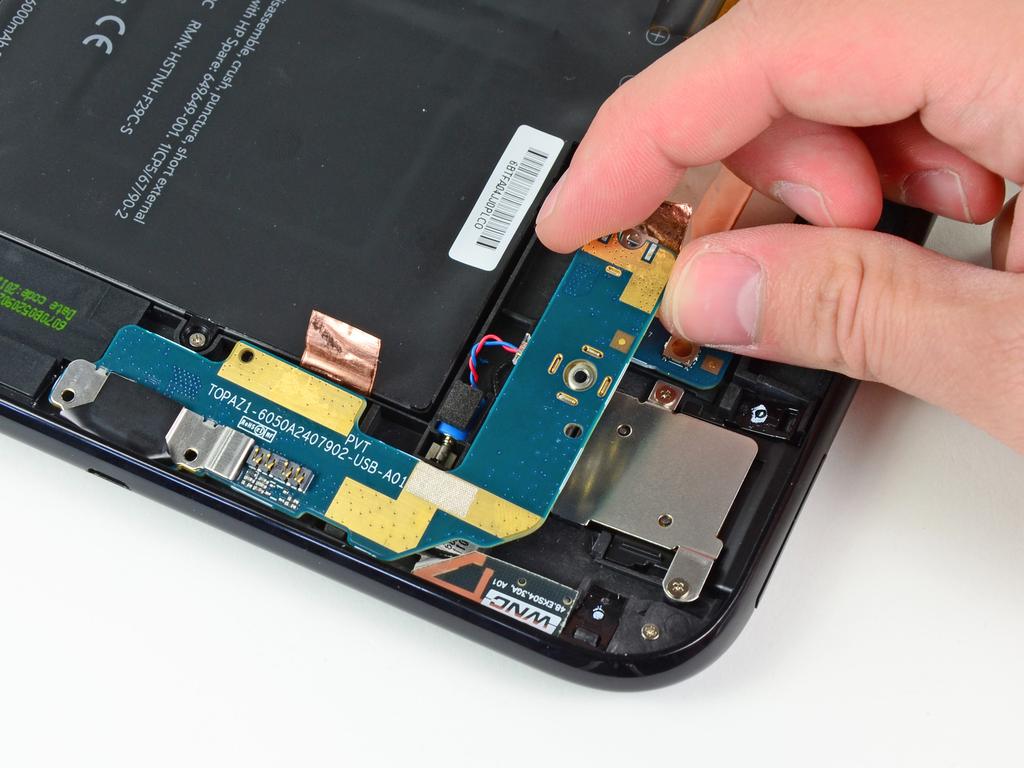 Step 14 Pull the USB connector board away from the bottom edge of the rear case and lift, but do