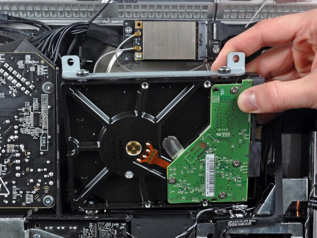 securing the upper hard drive bracket to the outer case.