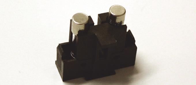 ) 4. Loosen the fuse holder by carefully prying under the notch on the left side of the holder with a small standard (flat blade) screwdriver; see Figure 5-9. Figure 5-9. Loosen the Fuse Holder 5.