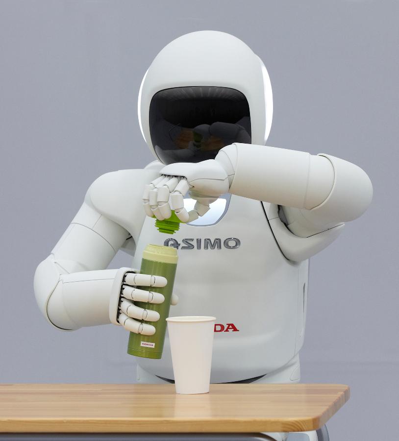 CHAPTER 1. INTRODUCTION Figure 1.1.: The Honda ASIMO demonstrates a vision for household assistance (Source: Honda). for disaster relief.