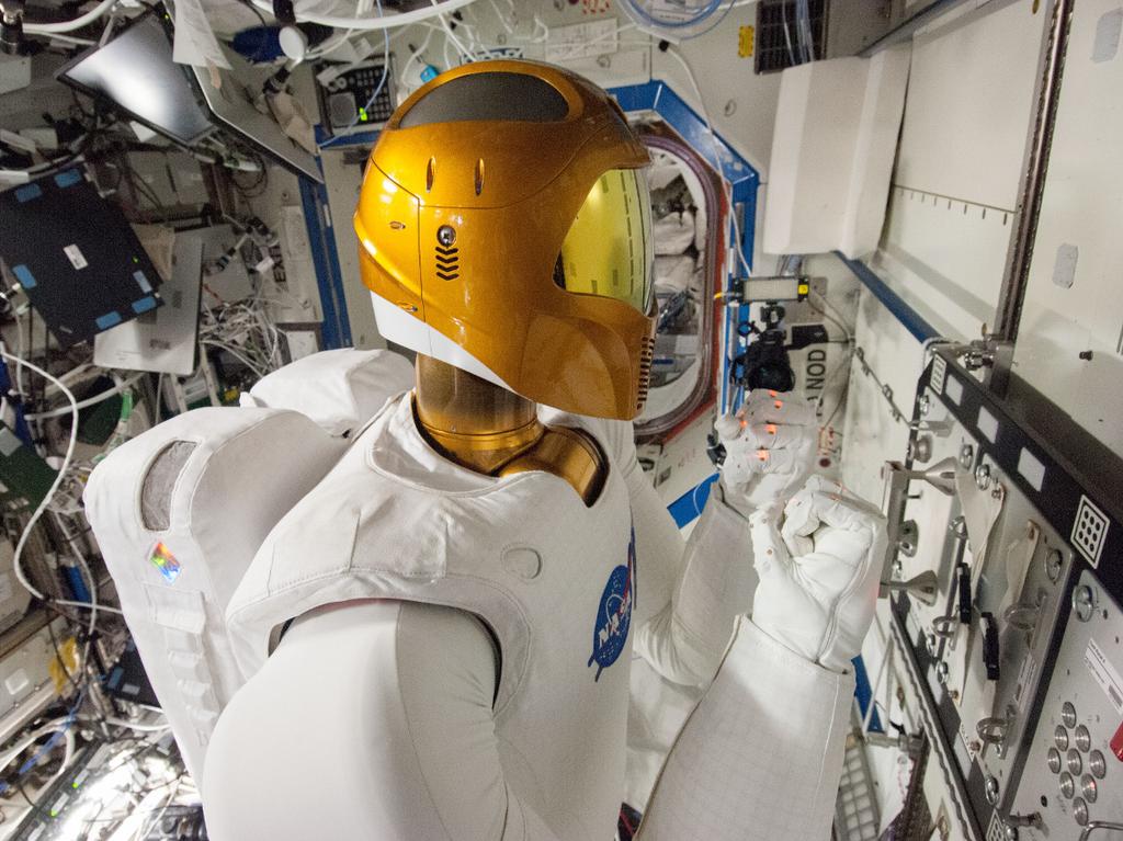 Figure 1.2.: Left: NASA employs the Robonaut 2 humanoid alongside astronauts on the International Space Station, where instruments and tools are designed for humans (Source: NASA).