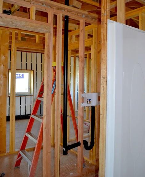 With the washing machine utility box in the wall attaching the pipes is easy.