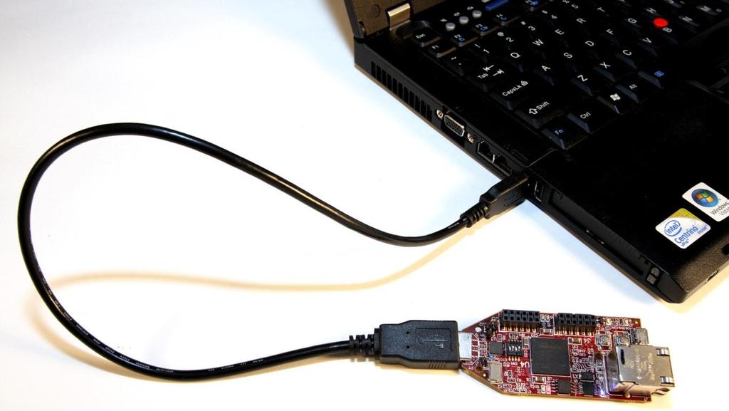 5. Connect the S6LX9 MicroBoard to the host PC as shown in Figure 4 by plugging it into an open USB port or by using the USB extension cable (Type A Male to Type A Female).