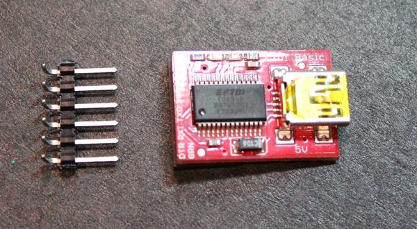You can purchase a USB adapter like the FTDI 5V Basic Breakout Board from SparkFun.com (sku: DEV-10008). Make sure to orient the two boards correctly.