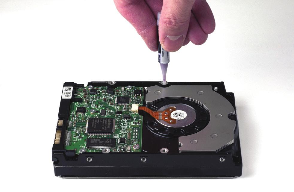 Remove a SATA drive from its packaging and set it in on a flat, level surface with the label side down.