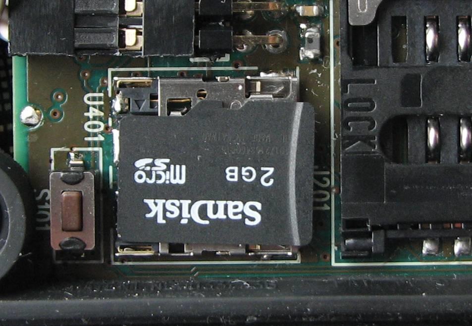 Appendix C Installing the Micro SD card To insert a Micro SD card into the reader open the hinged lid of the card reader, orientate it as