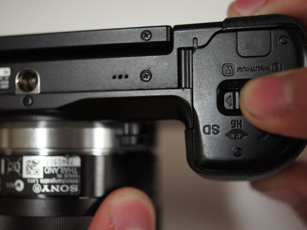 If the camera is on, rotate the power switch on top of the camera counterclockwise to turn the camera off.