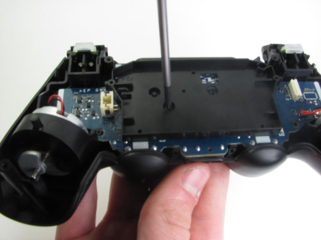 Step 6 Disassembling DualShock 4 Motherboard Assembly Remove the single 6.