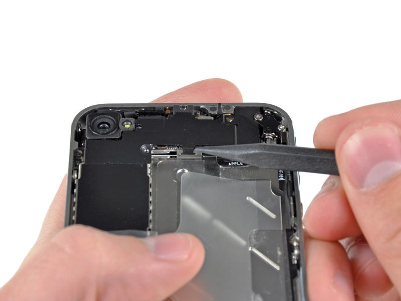 Remove the Wi-Fi antenna from the iphone. Make sure you don't lose the metal clips on the top of the cover where the 4.