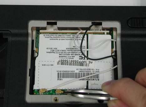 3. Remove the Wireless LAN module by opening the 2 latches