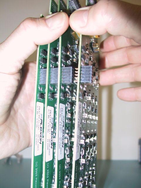12 The circuit boards are held together by three (3) connectors; one connector near the center and two connectors at the rear-panel (data-cable) end.