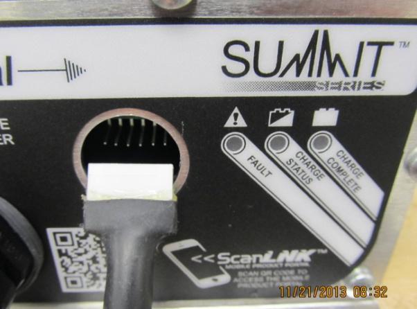 5. SUMMIT Chargers only! Remove the rubber cover plug on the charger and plug in the RS-232 end into the charger.