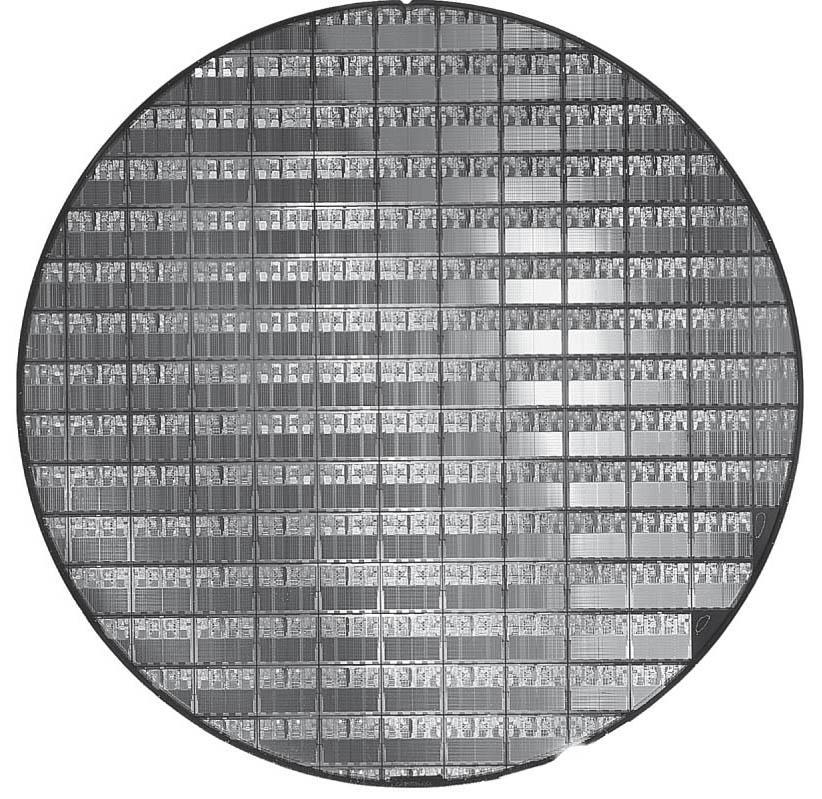 A 12-inch (300mm) wafer of AMD Opteron X2 chips, the predecessor of Opteron X4 chips (Courtesy AMD). The number of dies per wafer at 100% yield is 117.