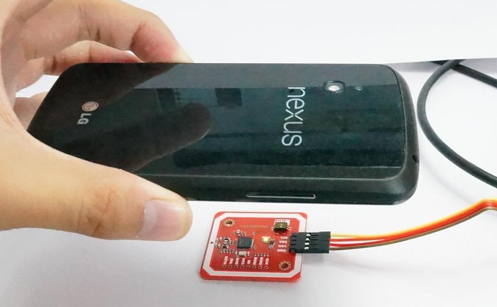 Upload the code to Arduino, and open Serial Monitor: Put a NFC-support phone on the module (the following phone is Nexus 4): On Android phone, if you have set the default browser, it will start the
