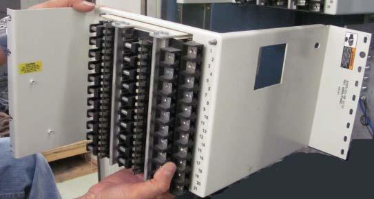 16. Unscrew and set aside the screws from the side of the panel(s), as shown in Figure 20. 17. Slide the panel(s) out of the enclosure and set them aside. 18.