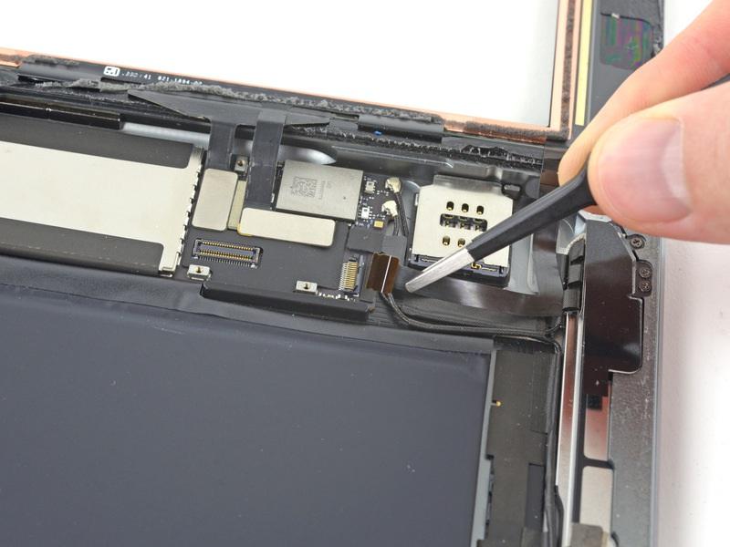 Carefully pull the home button ribbon cable straight