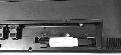 Place back the cable TV tuner dongle cover on the compartment of the terminal and fasten it with 2 screws. 10.