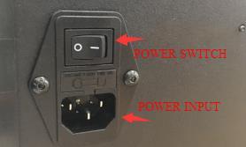 Plug one end of the included power cord into the power input on the printer,