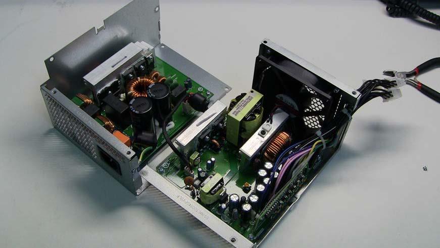 2. Lift and pull handle to remove the top plate of the power supply chassis. The unit will fall open into two parts, as shown in the following figure. 3.