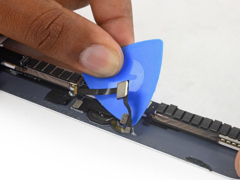 Step 35 Use an opening pick to continue separating the home button ribbon cable from