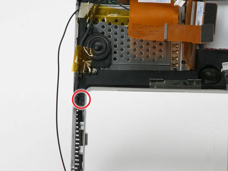 Remove the two black Phillips screws from the yellow plastic board above the USB port on the left