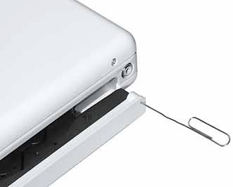 6. Use a soft cloth to protect the display face and close the computer. 7. Using a straightened paper clip, open the optical drive.