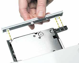 When removing the optical drive bezel, putting pressure on the drive tray can damage the drive.
