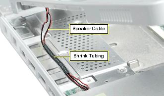 With the top case loosened, note how the speaker cable is routed.