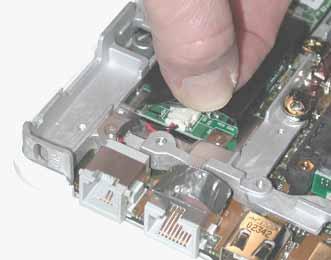 3. Lift up the modem sleeve and disconnect the RJ11 modem cable from
