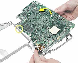 8. Lifting the logic board at the back ports, tilt up the logic board to remove it from the frame.