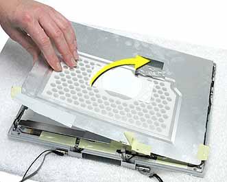 10. Loosen the remaining tape that secures the shield to the assembly.