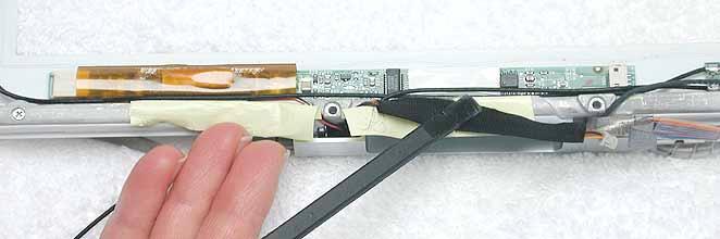 Procedure 1. With the bezel assembly lying on a soft cloth, disconnect the data cable from the right end of the inverter board at CN1. 2.