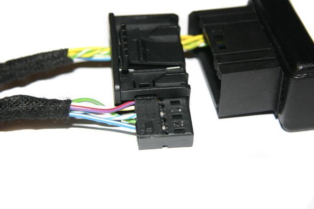 Insert 12-pin insert into black connector of