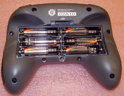 Remove the battery cover. c. Install six identical batteries as shown.