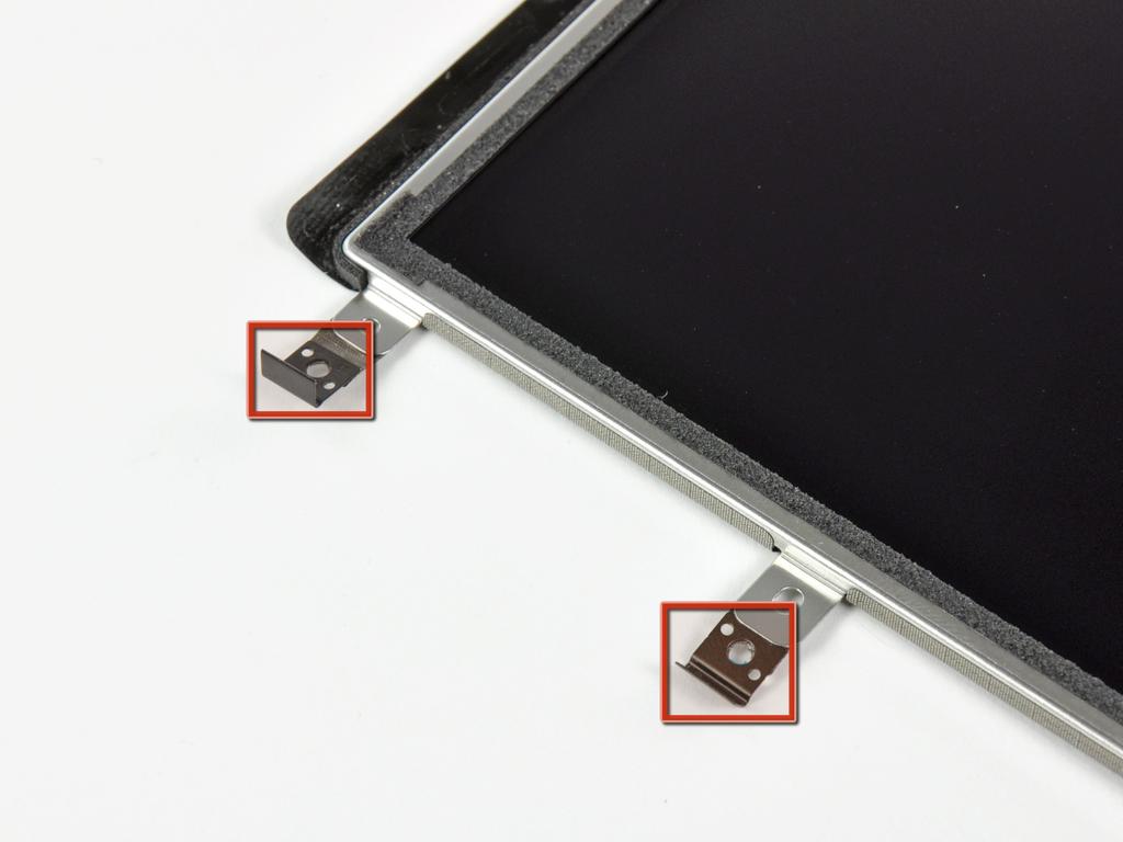 If you are replacing the LCD as well, transfer the strip of EMI tape to your new LCD.