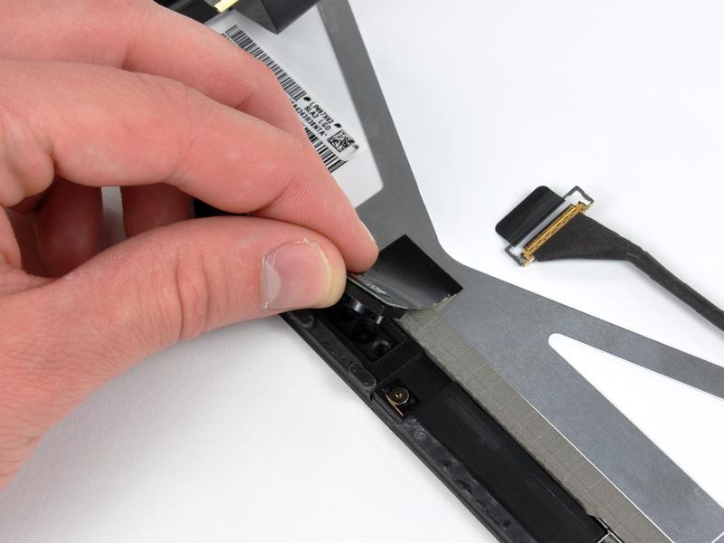 Use the edge of a plastic opening tool to carefully pry the ambient light sensor board off the adhesive
