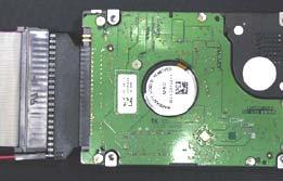 (cont d) Non-Quick-Click Hard Drive Installation 1. Connect the hard drive adapter and attached ribbon cable to the supplied hard drive according to Figure 4.