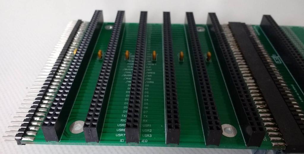 This backplane section has six RC2014 (80 pin) card sockets, an edge mounted 80 pin expansion plug and an edge mounted 80 pin expansion socket.