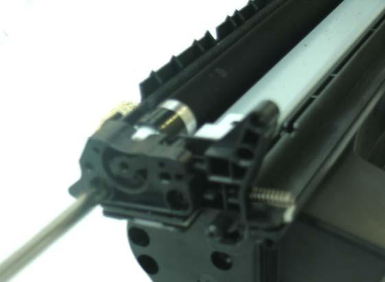 17. Pull the gear housing end cap from the end of toner
