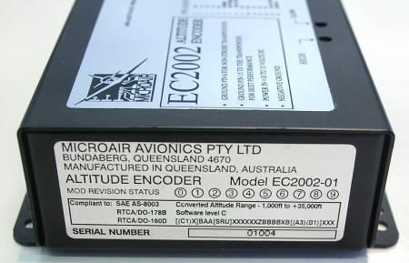 At the opposite end is the nameplate showing the compliance statements, the part number, serial number, and mod status.