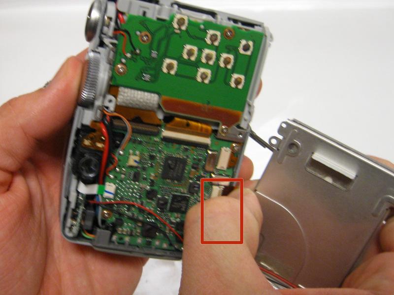 Carefully disconnect the LCD Screen ribbon cable away from its ZIF connector with your thumb and index finger.