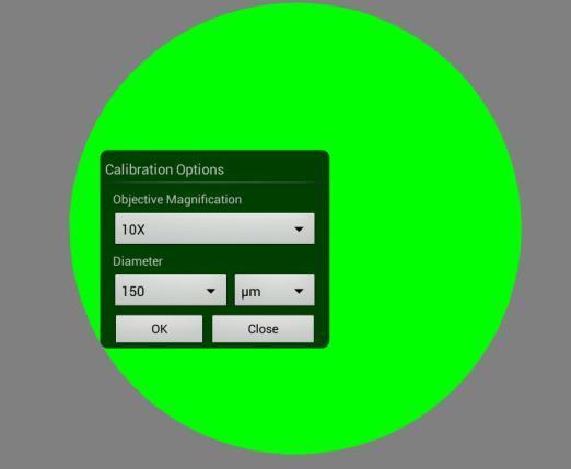 Now put the Calibration slide on the stage of the microscope and focus the dot in the center of the screen. For 4x Objective, use the 1.5mm dot. For 10x Objective, use the 0.6mm dot.