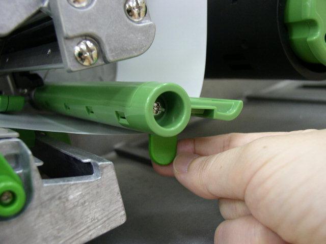 7. Close the print head mechanism making sure the latches are engaged