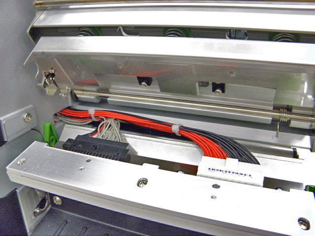 6. Connect the print head cable and carefully slide assembly