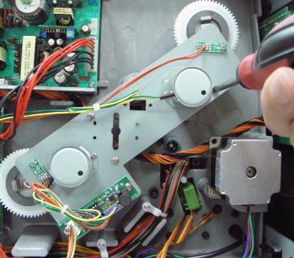 16. Use 3 screws to fasten the DC motor plate to the printer mechanism. Plug the DC motor control board harness into the DC motor control board.
