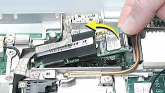4. Tilt up the end of the modem board to disconnect it from the logic board. 5. Important: Do not strain or remove the LVDS cable.