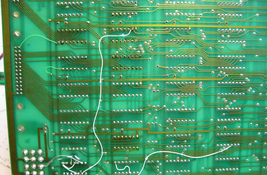 . Add the following flywires to the bottom of the PCB to connect the new reset LED circuit to the source signals. a. b. B8.0 [74LS07, signal /RESET] to A2.3 [74LS00] F4.6 [signal /PROCEED] to A2.9 F4.