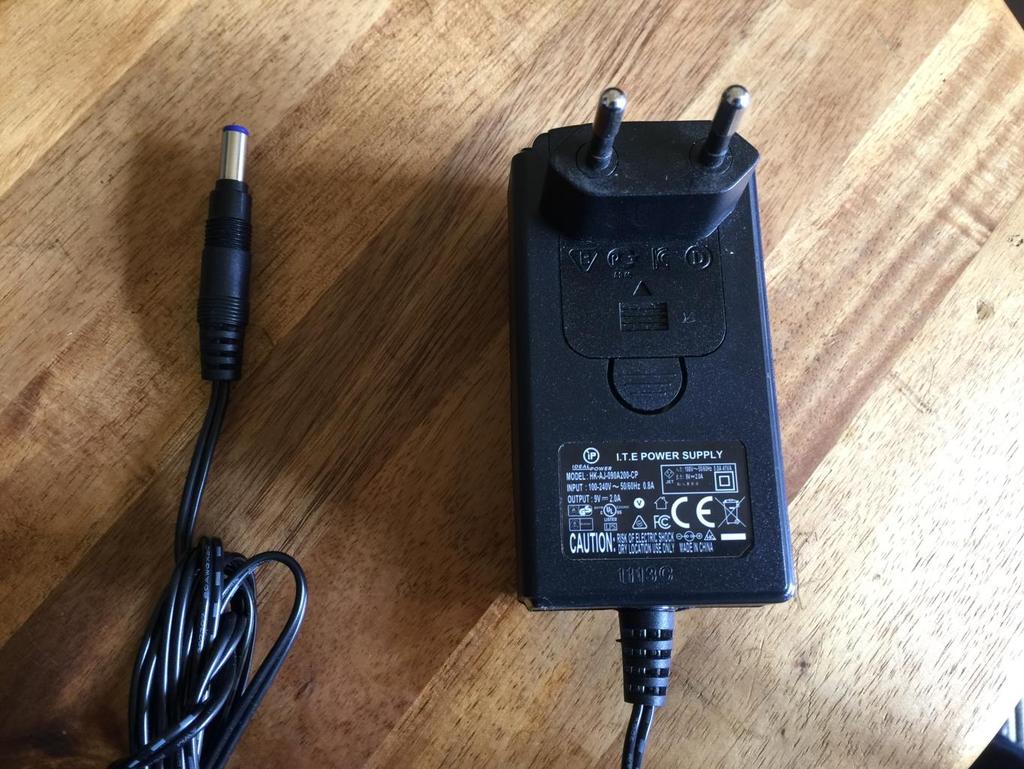 Connect the supplied power adaptor to the Power input, and to a 100V to 240V power source. It s a 9V, minimum 1A type with a 2.1 mm DC plug, with positive middle.