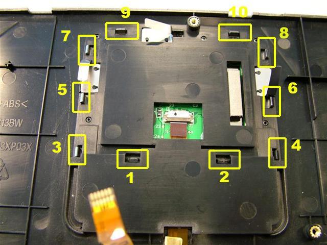 Unclip the Touchpad Frame in the order shown below. 3.