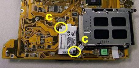7. Slide the Mainboard out of the Bottom Base Assembly. Figure 13 Modem 1.